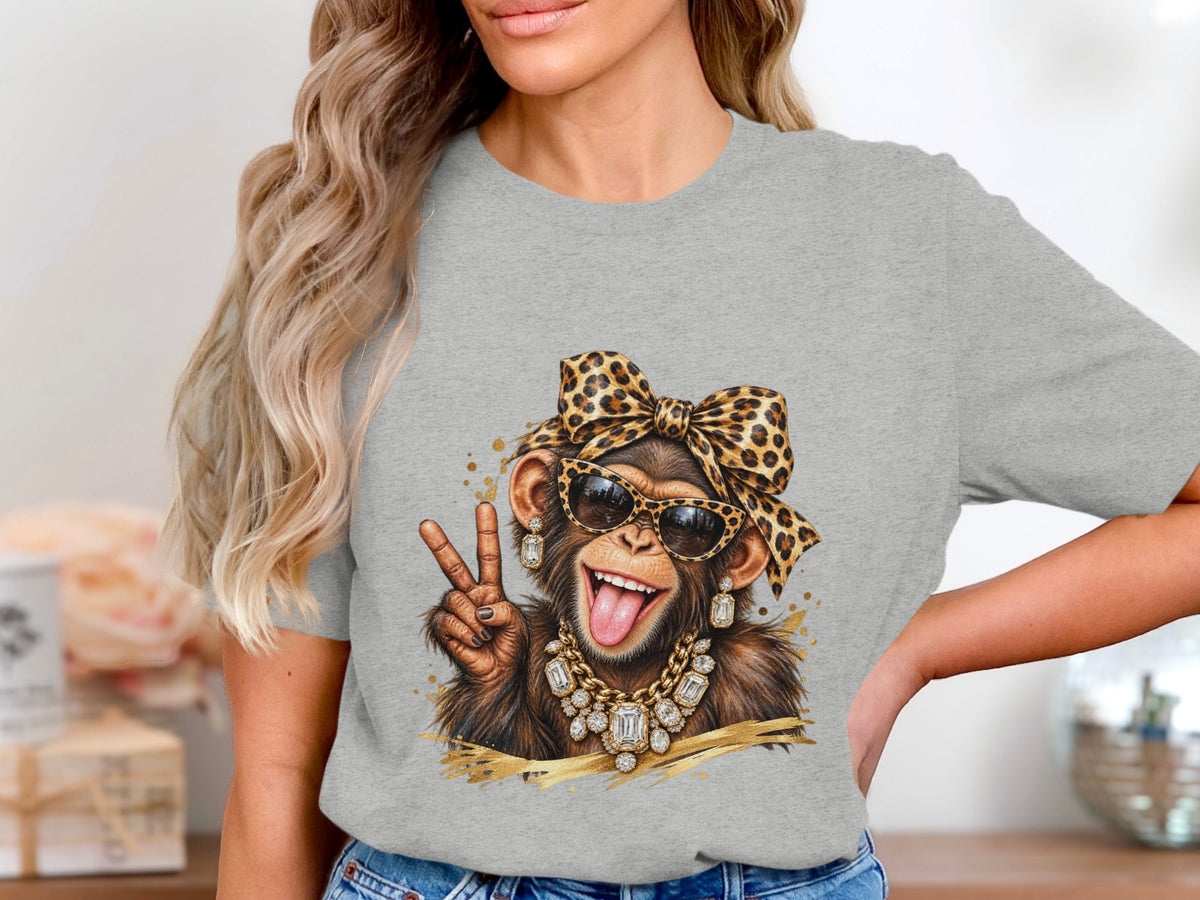 Chimpanzee wearing leopard print bow, sunglasses, and jewelry making peace sign.