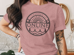 Pink t-shirt with circular graphic reading "I LEARNED IT ONLINE MUST BE TRUE."