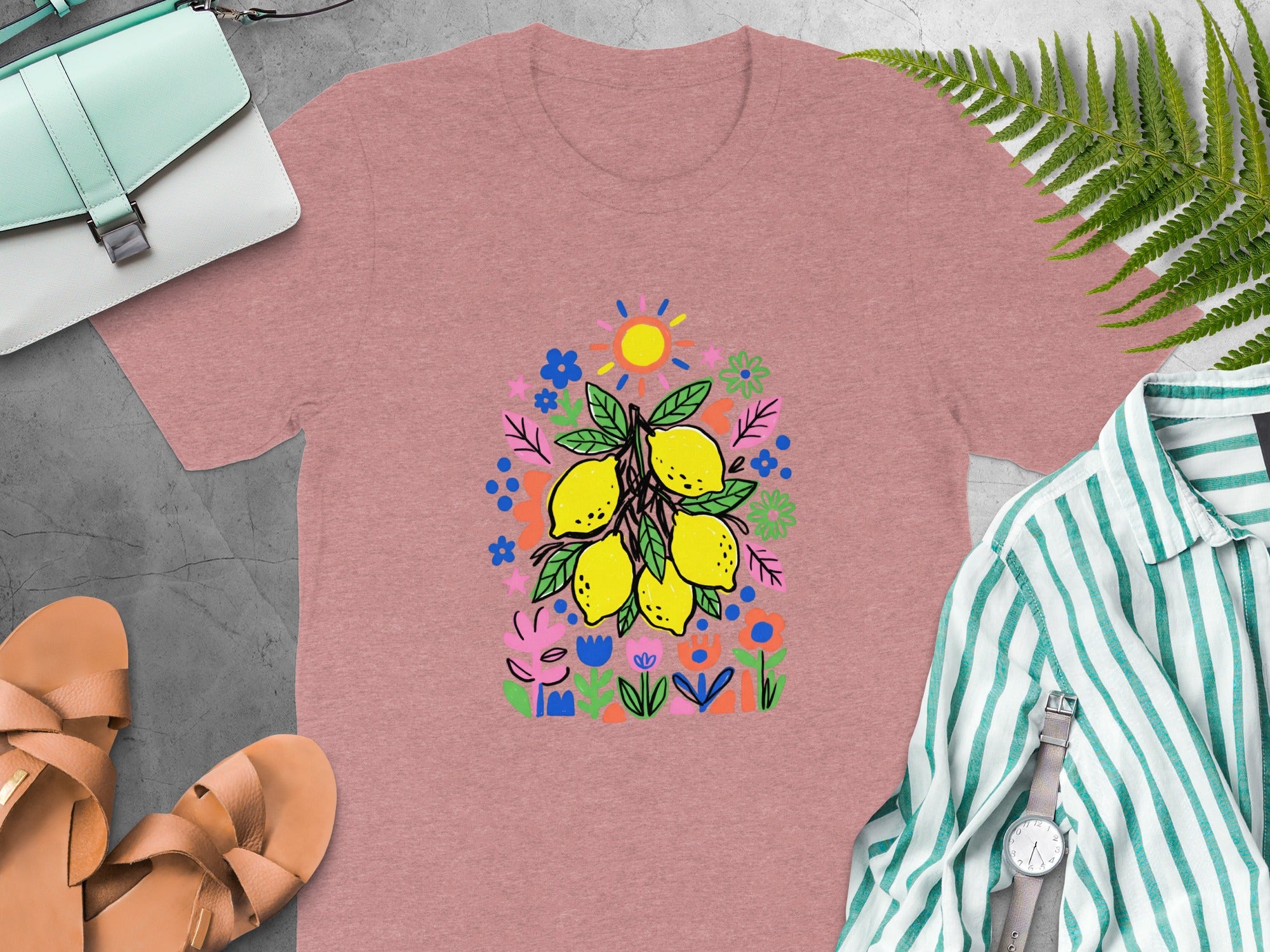 Rose t-shirt with a colorful lemon and flower graphic.