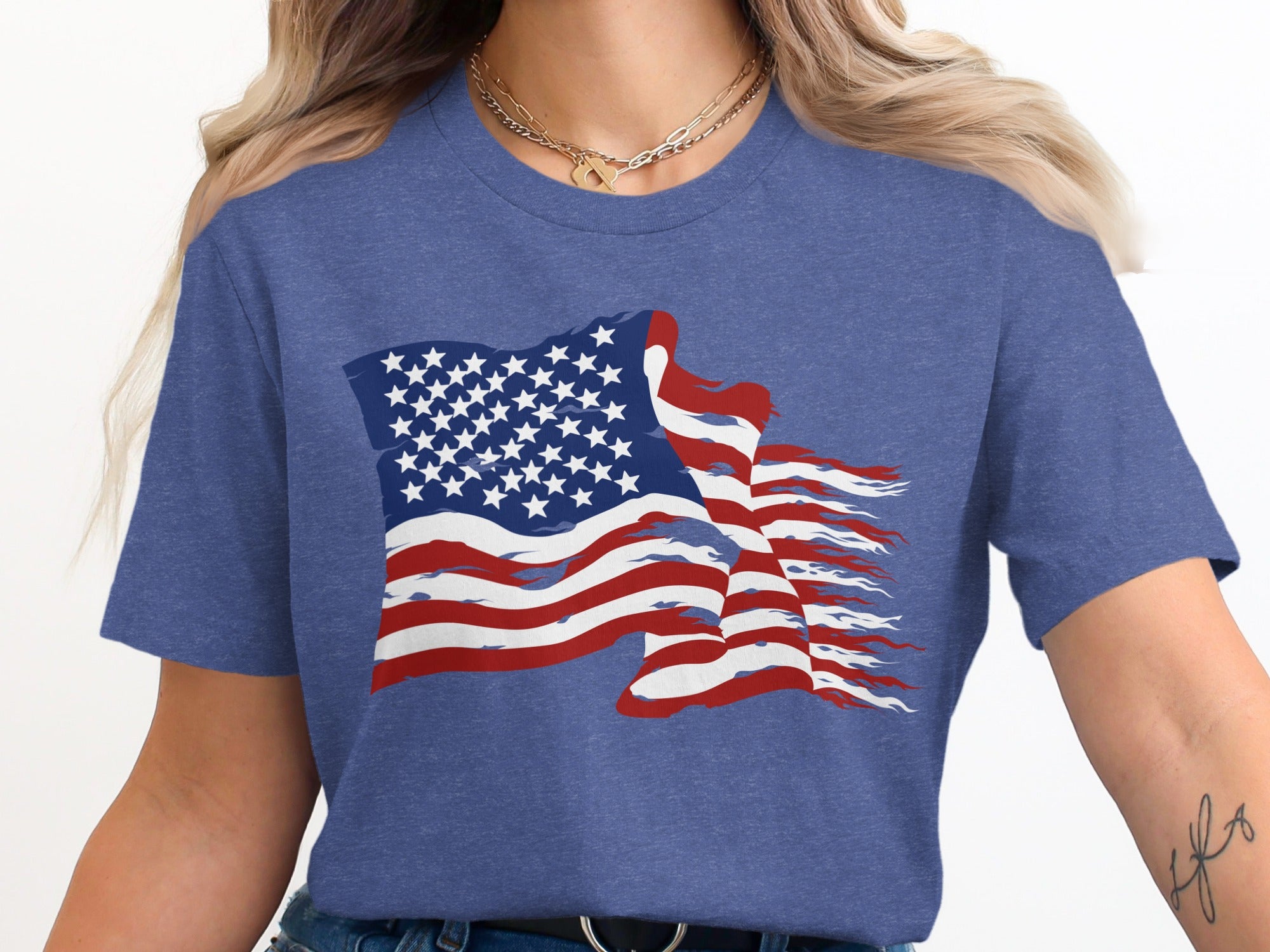 Distressed American flag graphic printed on a heather blue t-shirt.