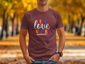 Burgundy t-shirt with "TEACH LOVE INSPIRE" and pencil graphic.