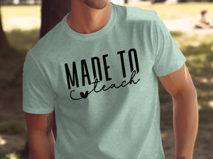 Pale green t-shirt with black text that reads "Made to Teach"