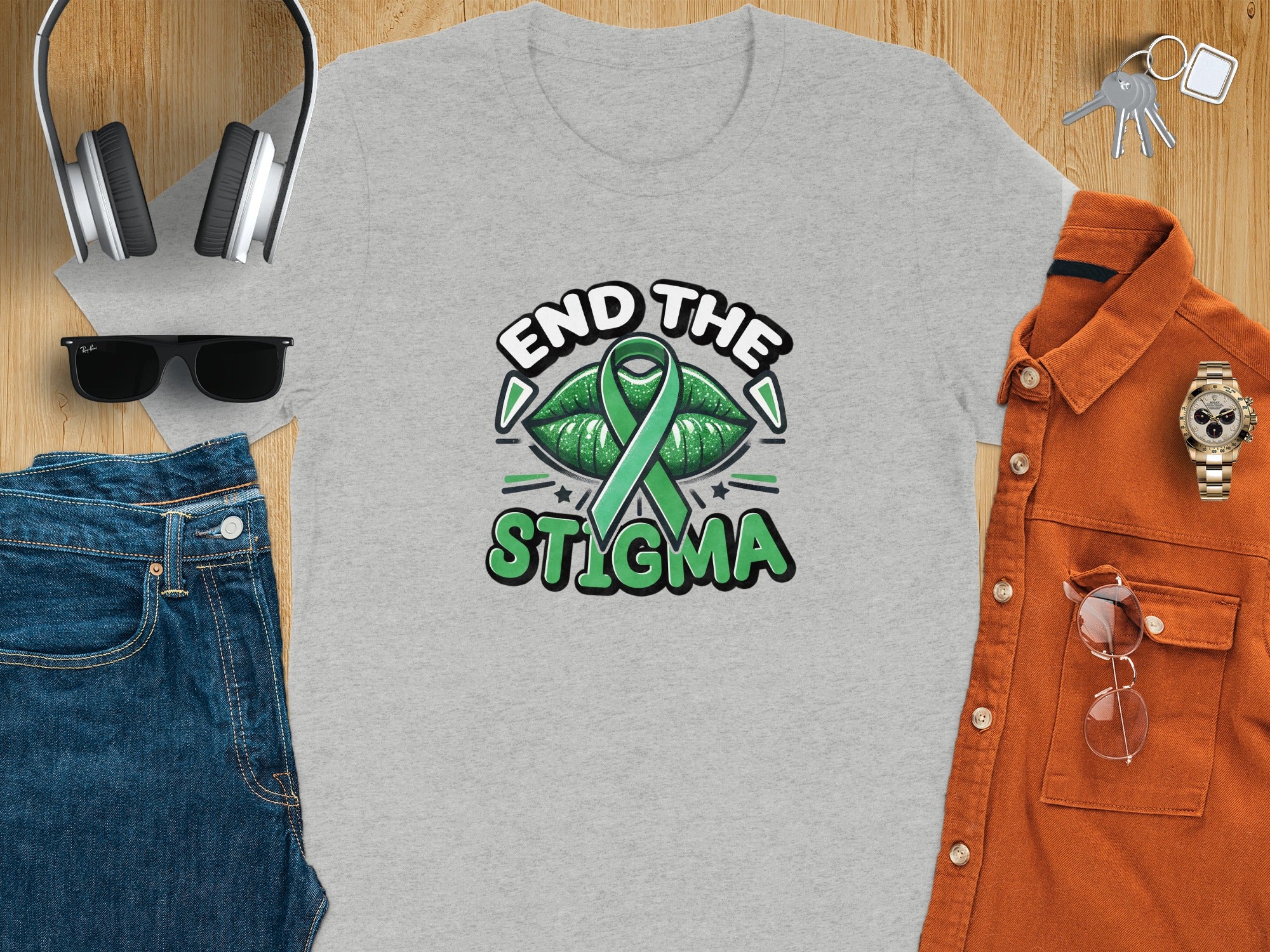 Grey t-shirt with "END THE STIGMA" text and green ribbon graphic.