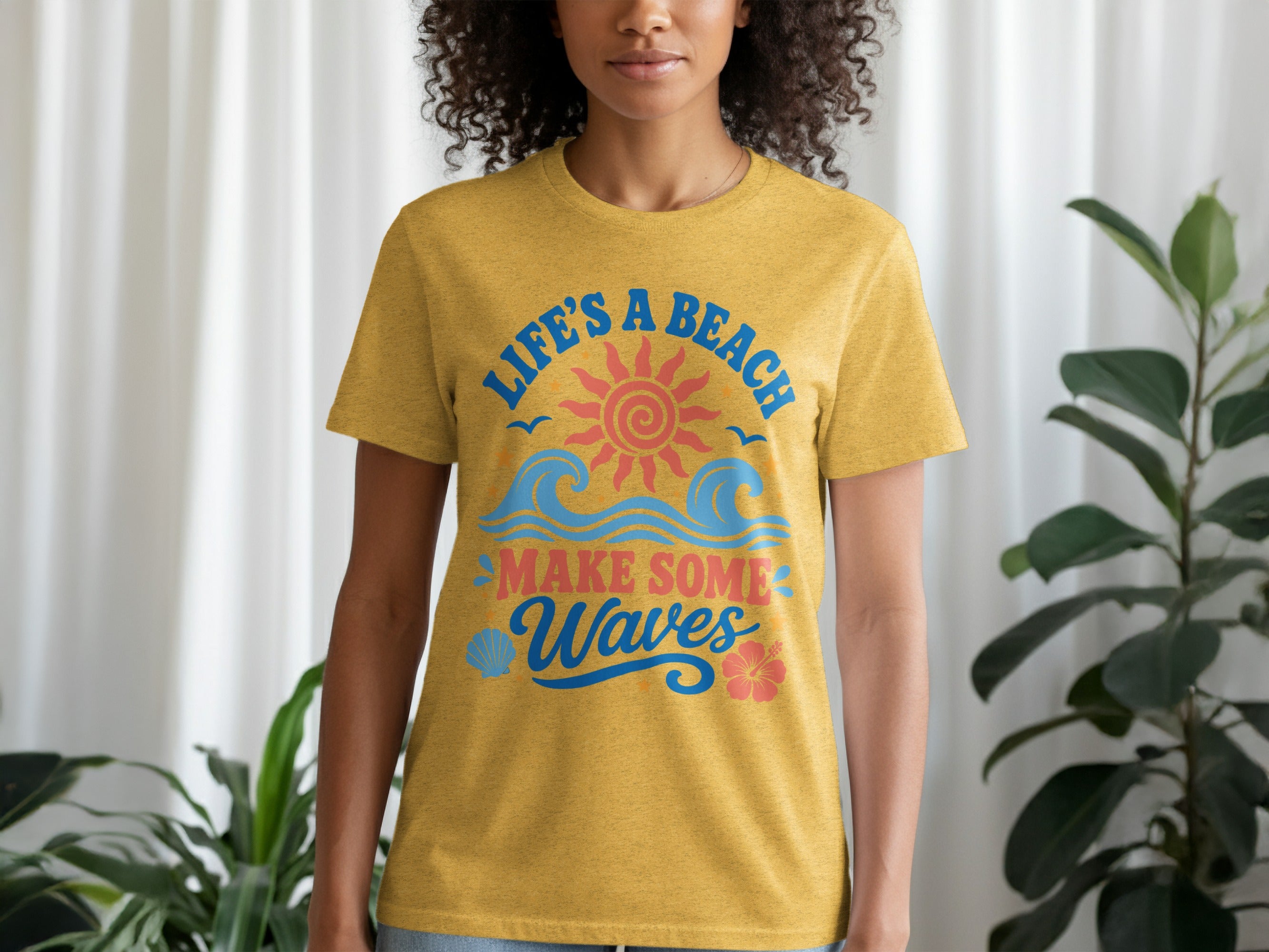 Yellow t-shirt with "Life's a Beach Make Some Waves" text, sun, waves, and flowers.