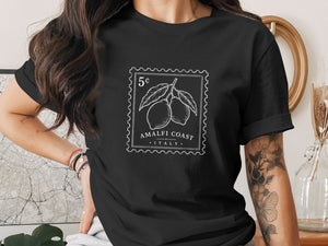 Black t-shirt with stamp graphic of Amalfi Coast lemons and text.