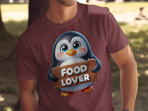 Brawn t-shirt featuring a cartoon penguin holding a wooden sign that says "FOOD LOVER".