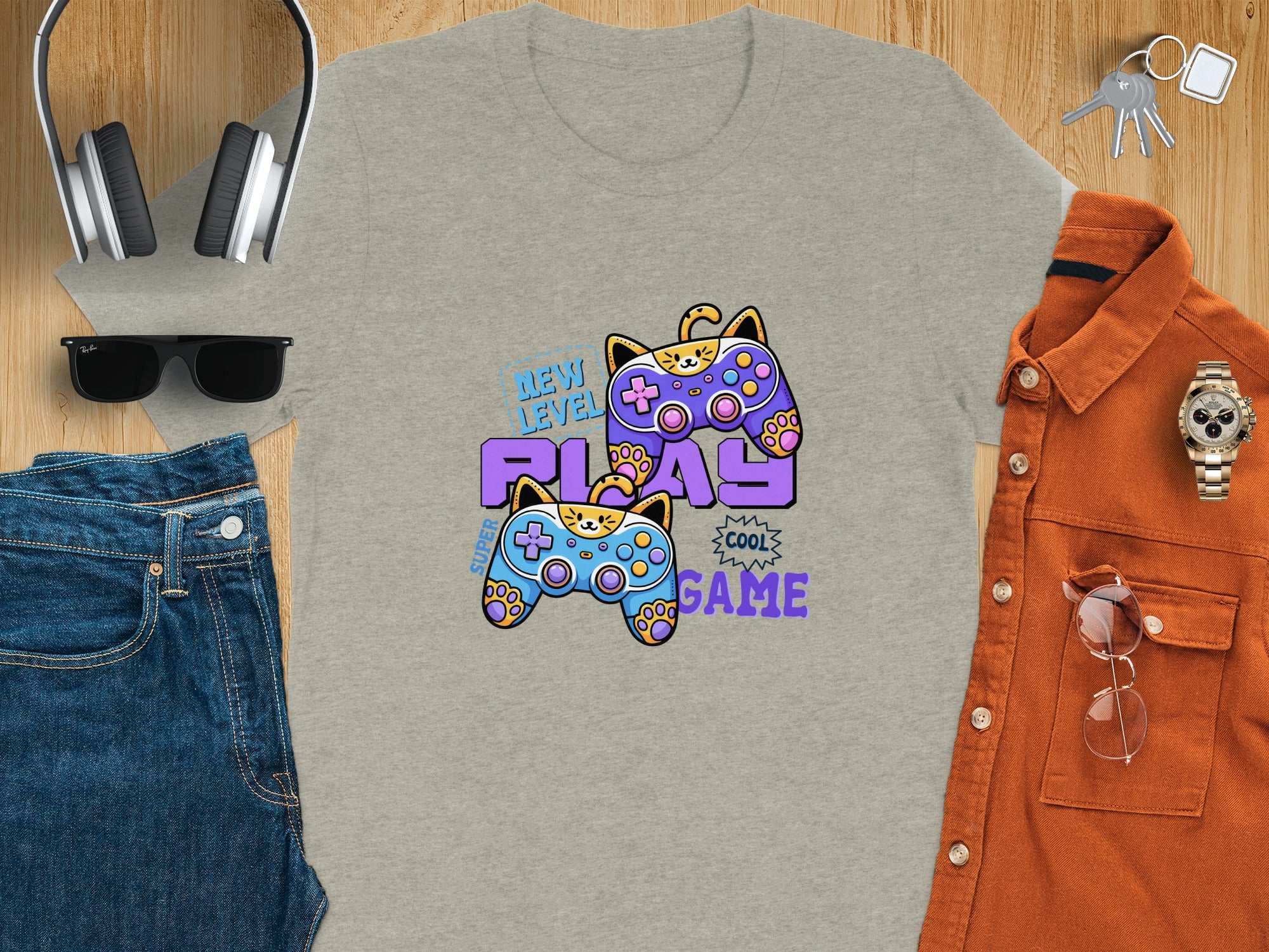 Grey t-shirt with cat-themed video game controllers and text.