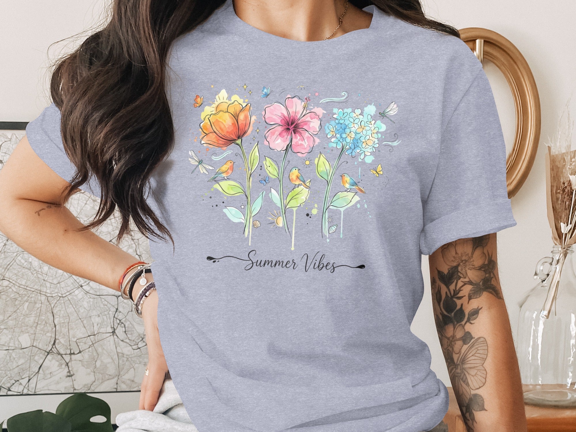 Light grey t-shirt with “Summer Vibes” text and watercolor flowers, birds, and butterflies.