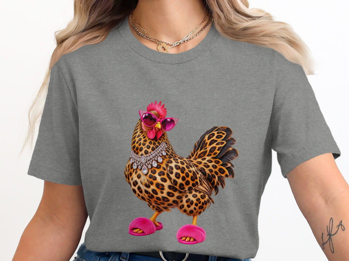 Leopard print chicken with pink sunglasses and fuzzy slippers on grey t-shirt.