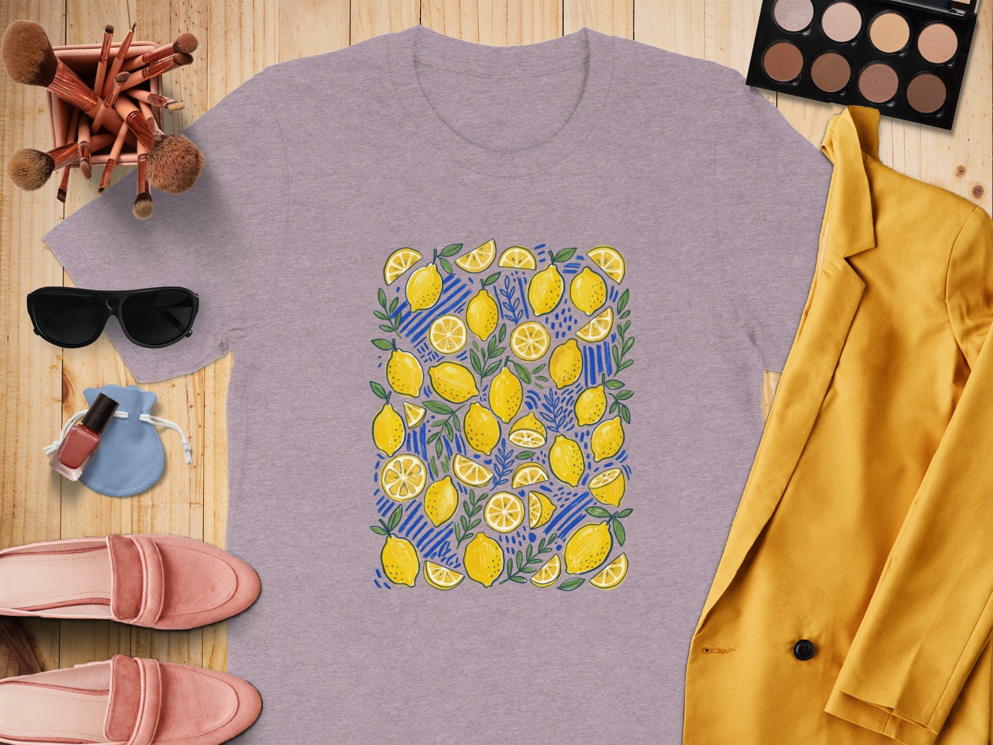 Light purple t-shirt with yellow lemons and blue stripes pattern.