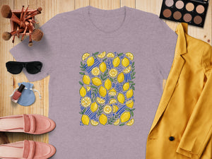 Light purple t-shirt with yellow lemons and blue stripes pattern.