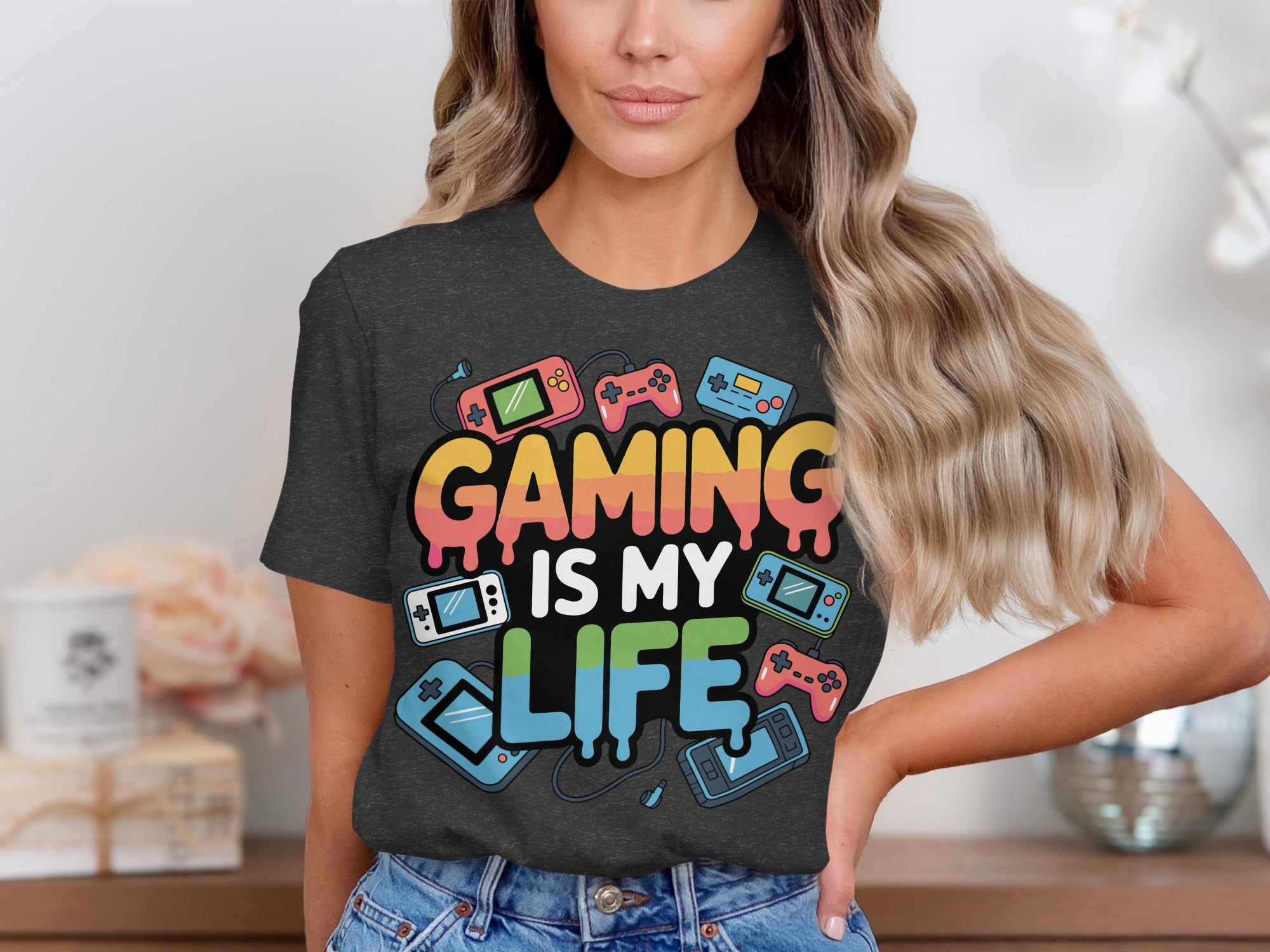 Dark grey t-shirt with "GAMING IS MY LIFE" and retro gaming consoles.