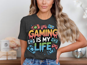Dark grey t-shirt with "GAMING IS MY LIFE" and retro gaming consoles.