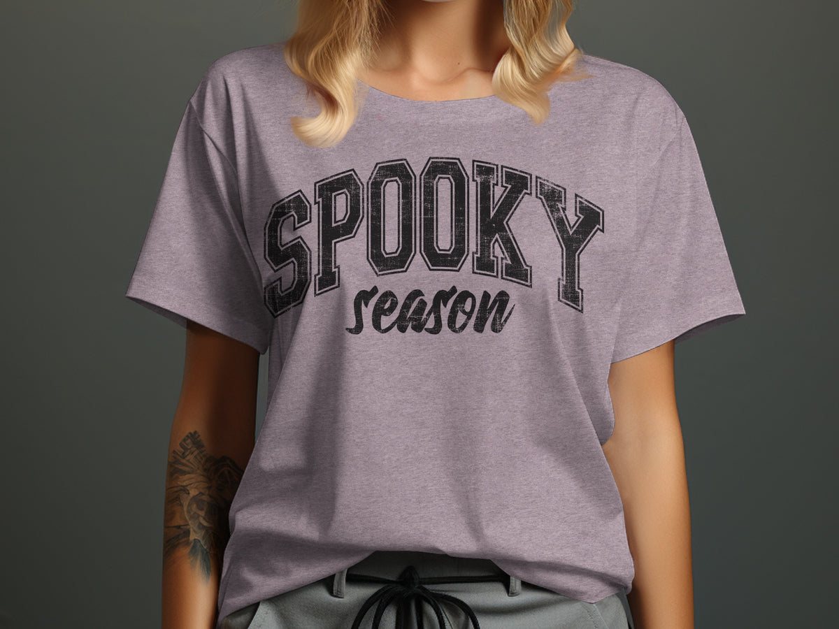Purple t-shirt with "SPOOKY season" text in distressed black lettering.