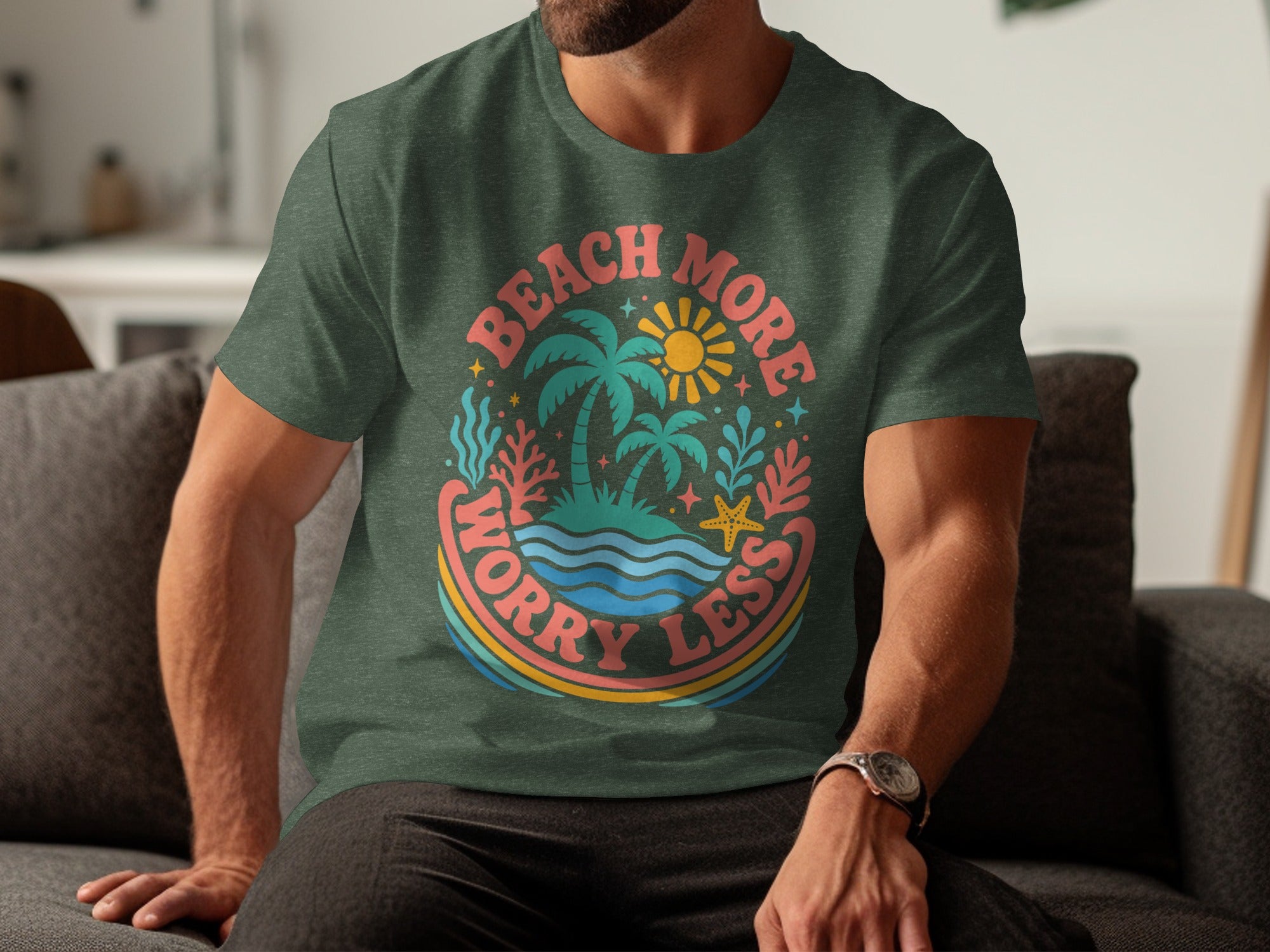 Green t-shirt with "Beach More Worry Less" in circle with palm trees, sun, and ocean.
