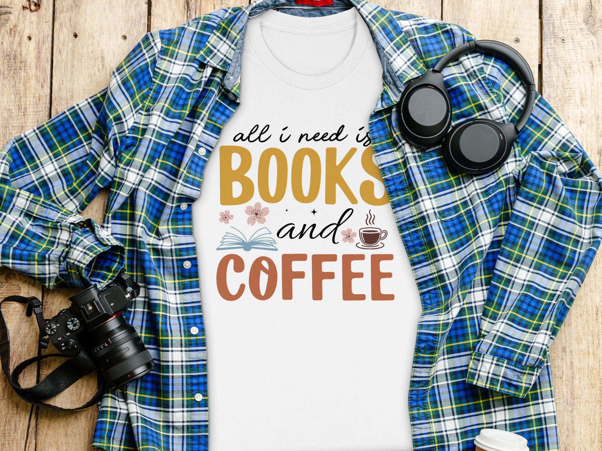 White t-shirt with text "All I Need is Books and Coffee" and graphics.