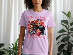 T-shirt with "I like my books spicy and my coffee icy" and illustrated books, chili, handcuffs, and drink.