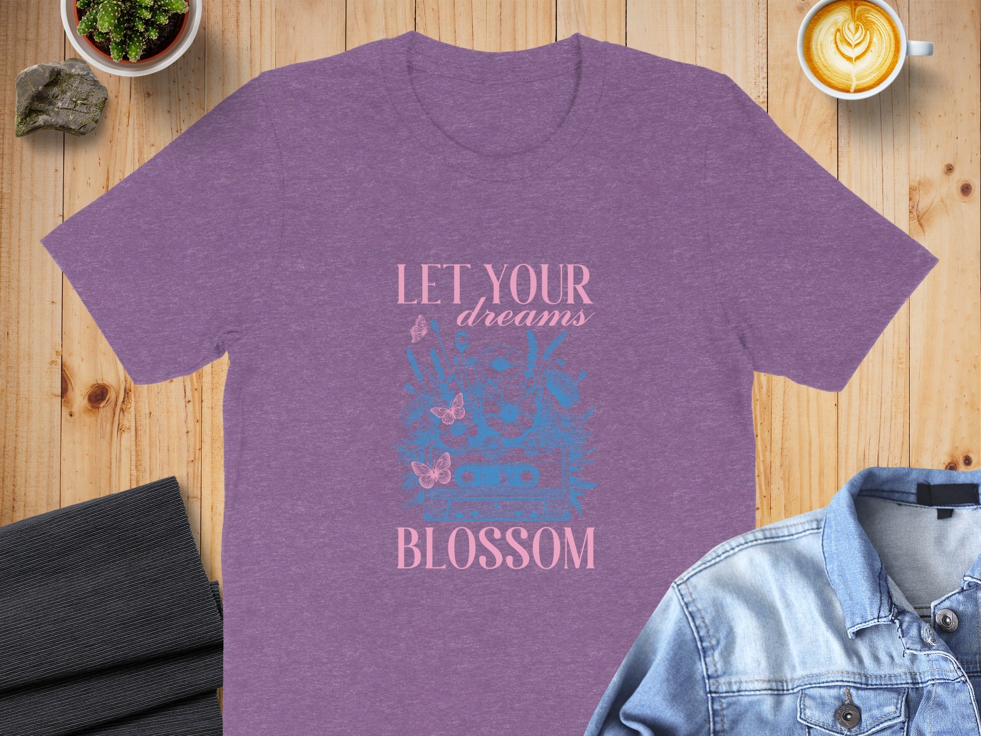 Purple t-shirt with "LET YOUR dreams BLOSSOM" text and butterfly design.
