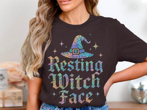Sparkly witch hat graphic with "Resting Witch Face" text on a dark tee.