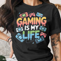 Black t-shirt with "GAMING IS MY LIFE" text and retro gaming graphics.