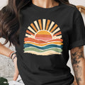 Black t-shirt featuring a retro sunset graphic with wavy lines.