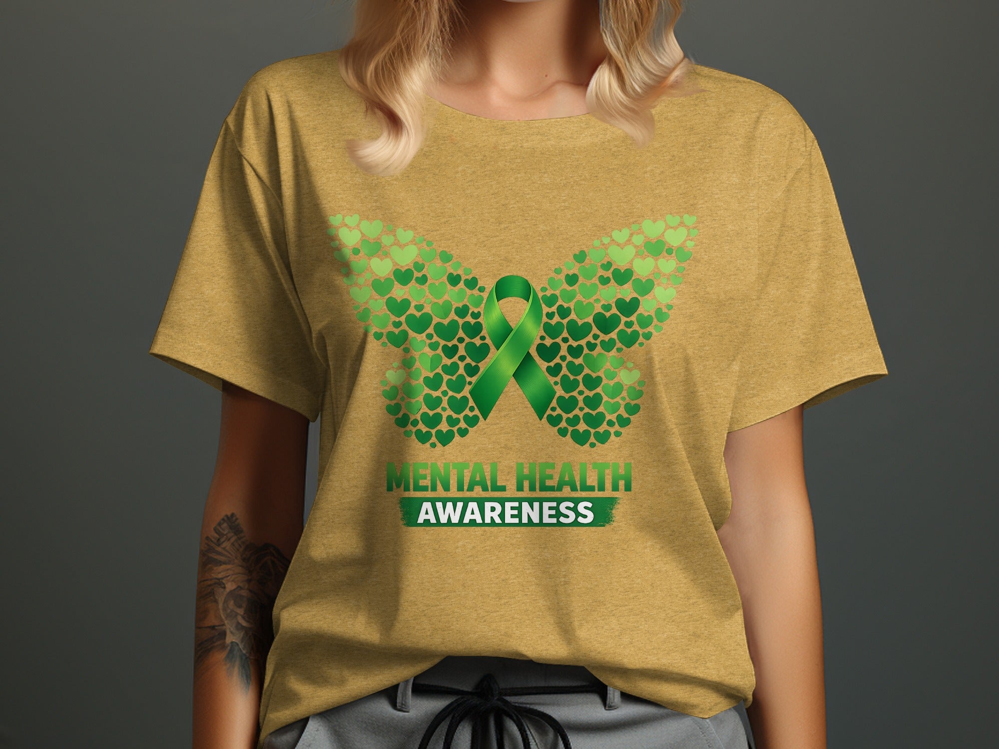 T-shirt with a butterfly design made of green hearts and a green awareness ribbon.