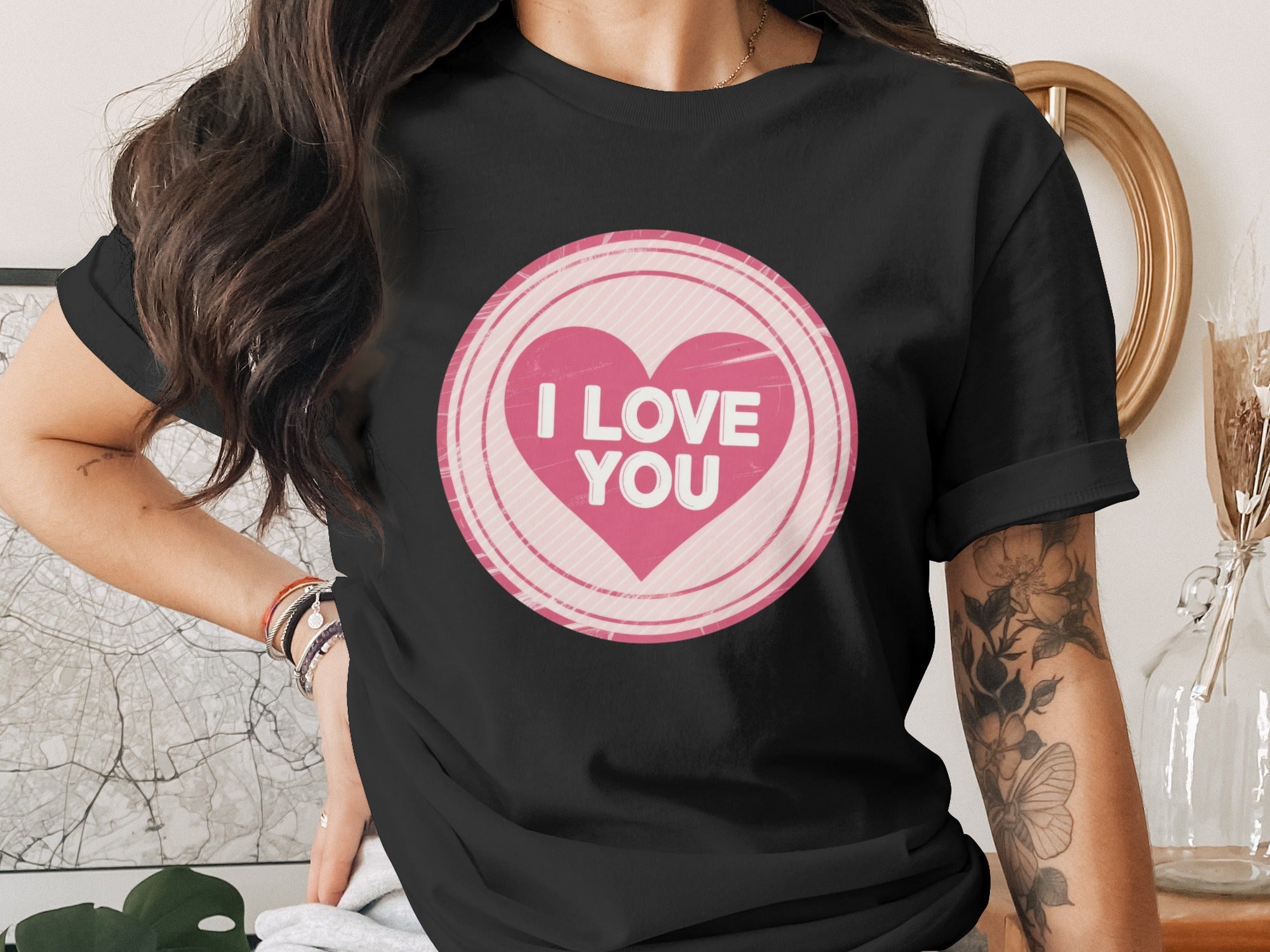 Black t-shirt with a pink heart graphic reading "I LOVE YOU".