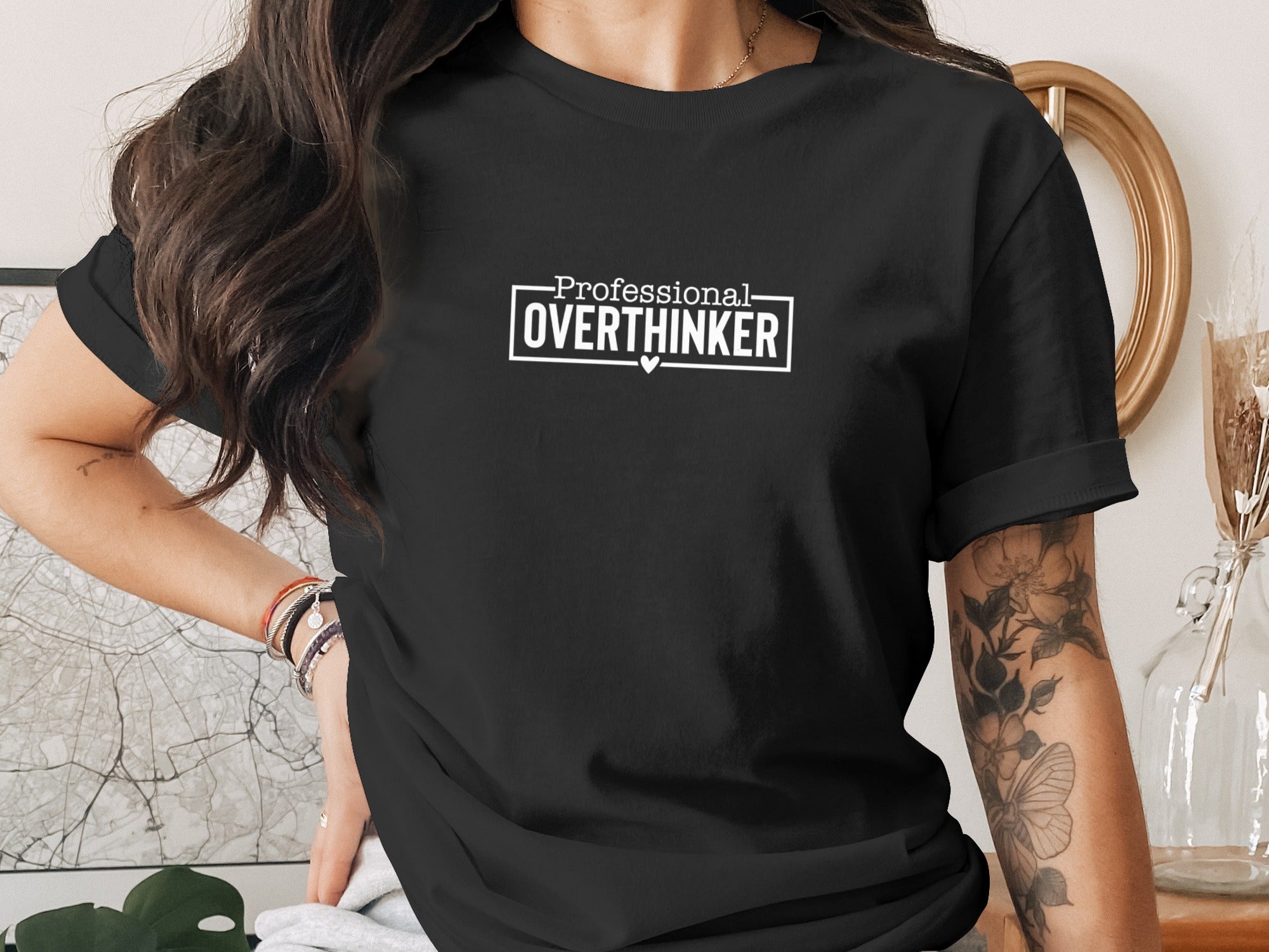 Black t-shirt with white text "Professional OVERTHINKER" and a small heart.