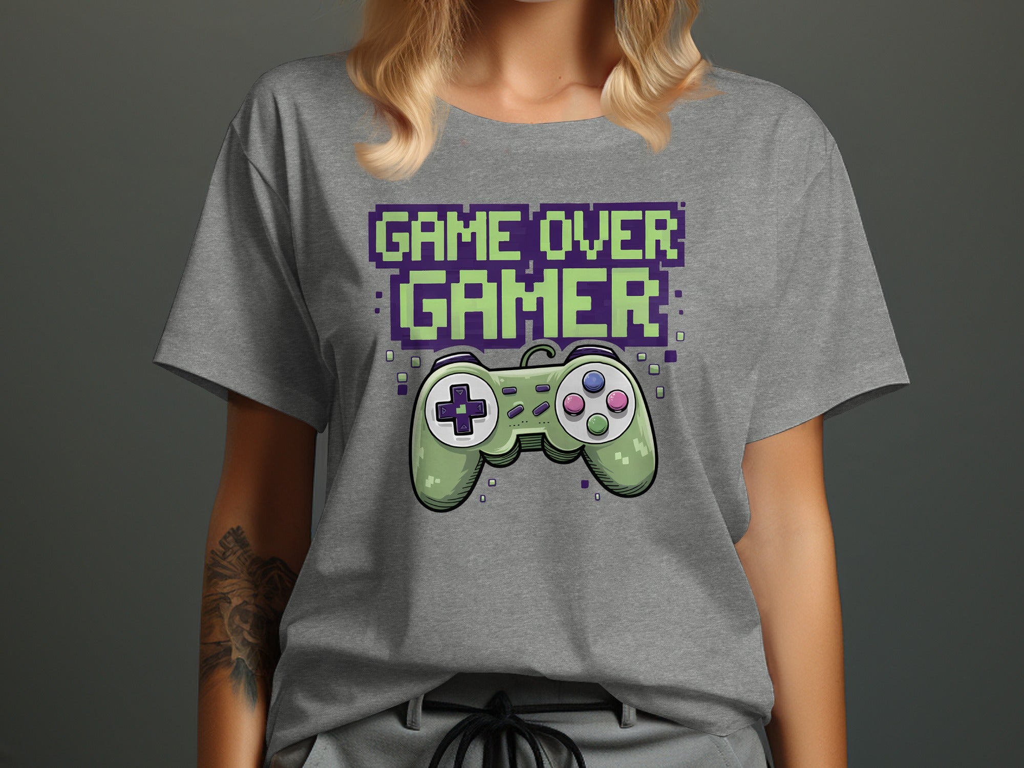 Gray t-shirt with "Game Over Gamer" text and a green video game controller.