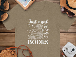 T-shirt with white text and graphic: "Just a girl IN LOVE with her BOOKS".