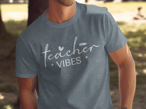 Heather grey t-shirt with "teacher vibes" text and pencil graphic.