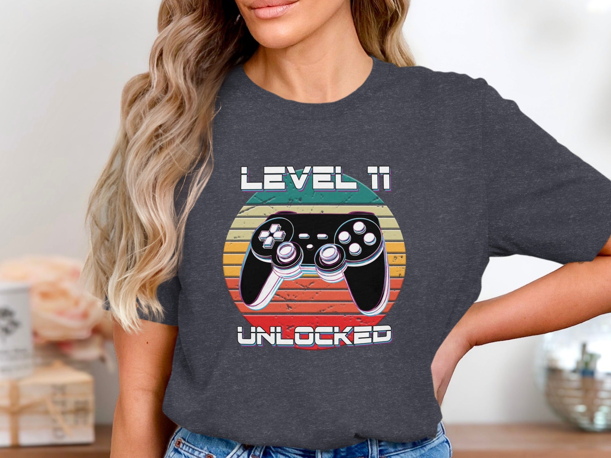 Shirt with graphic "Level 11 Unlocked" and a retro video game controller.