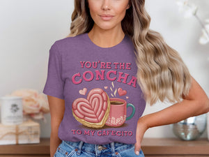 Purple t-shirt with "You're the concha to my cafecito" and sweet treat graphic.