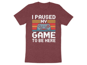 Maroon t-shirt with "I paused my GAME to be here" text and pixelated game controller.