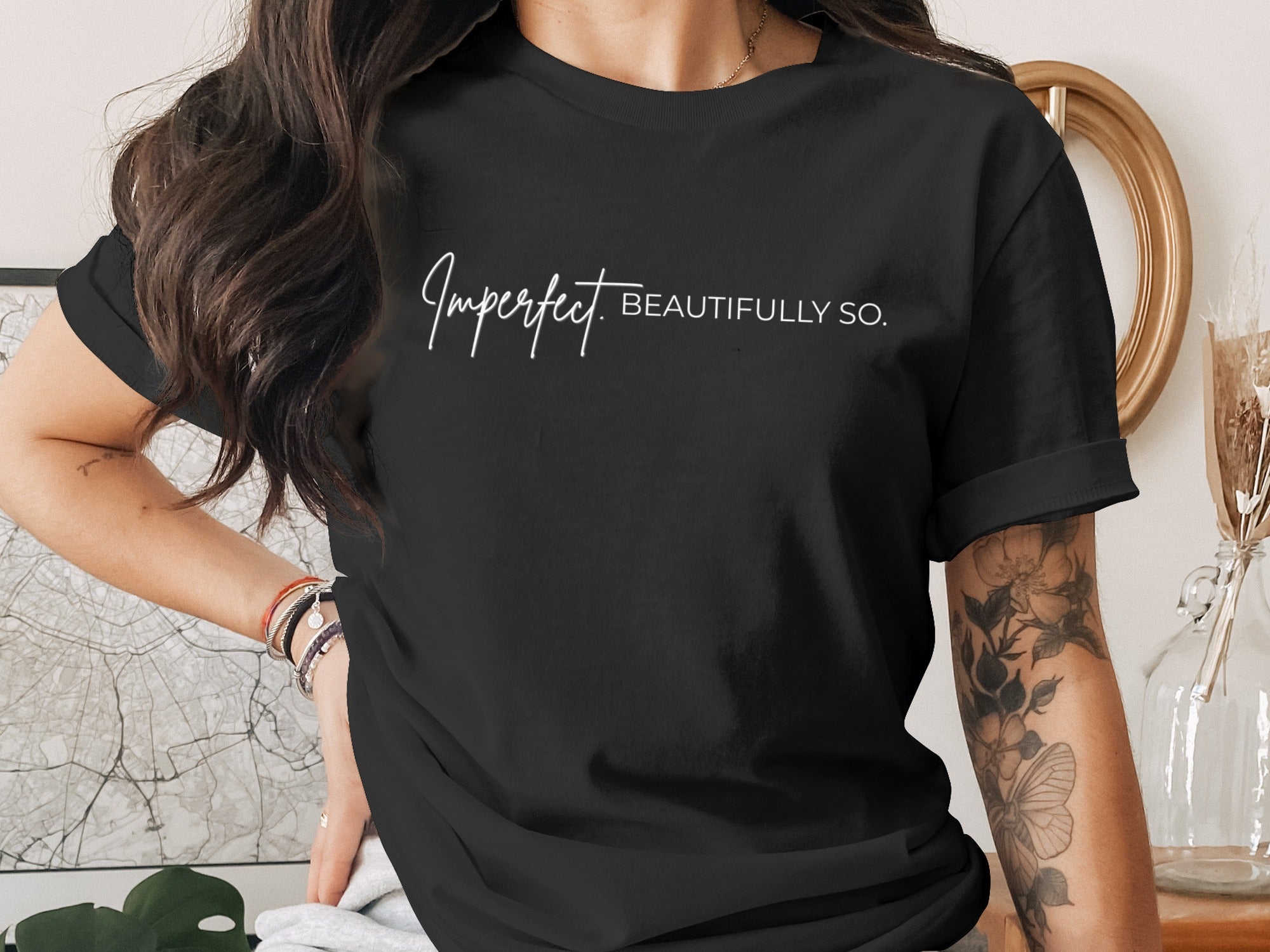 Black t-shirt with white text reading "Imperfect. BEAUTIFULLY SO."