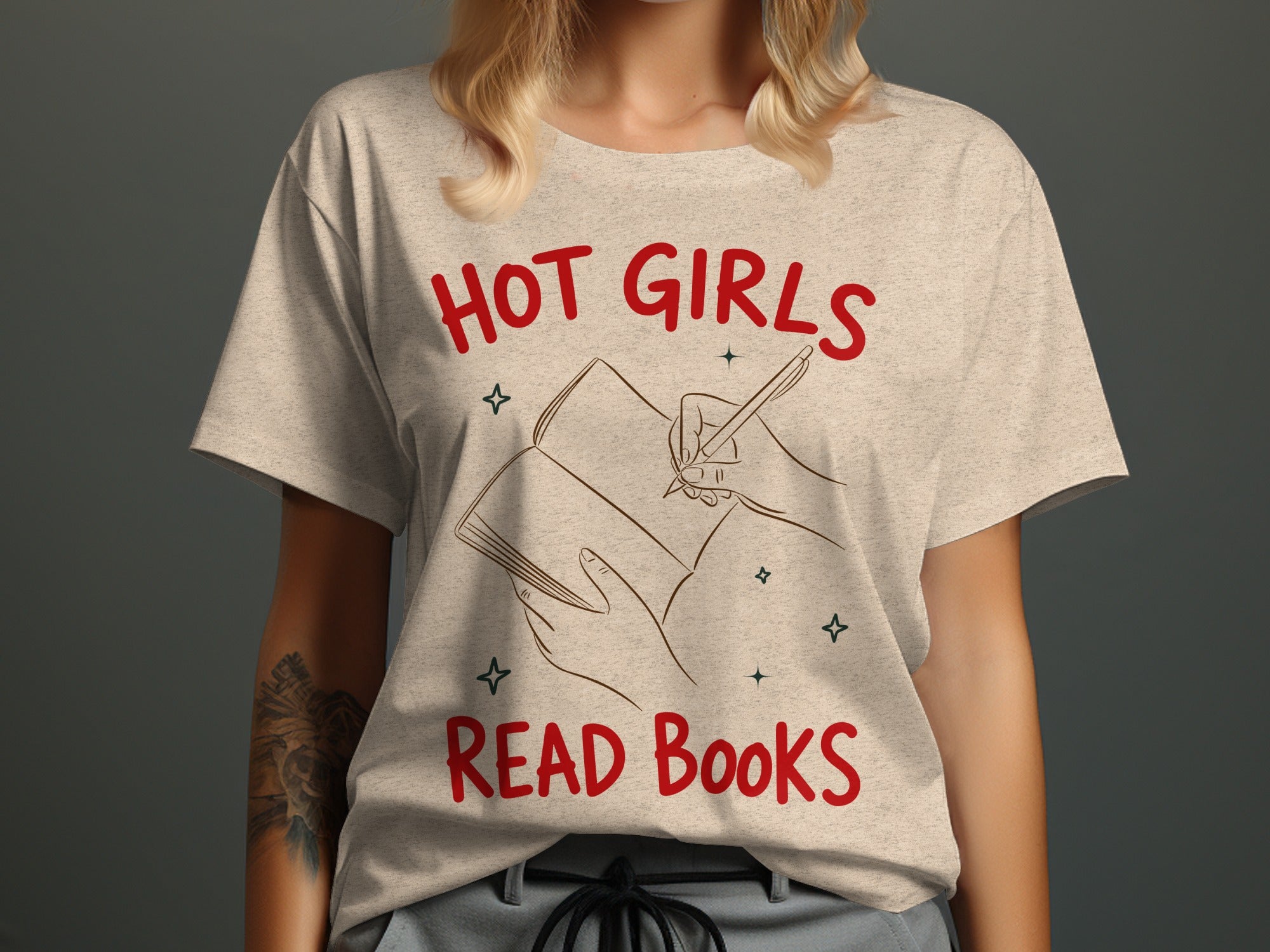 Cream t-shirt with red text "HOT GIRLS READ BOOKS" and book drawing.