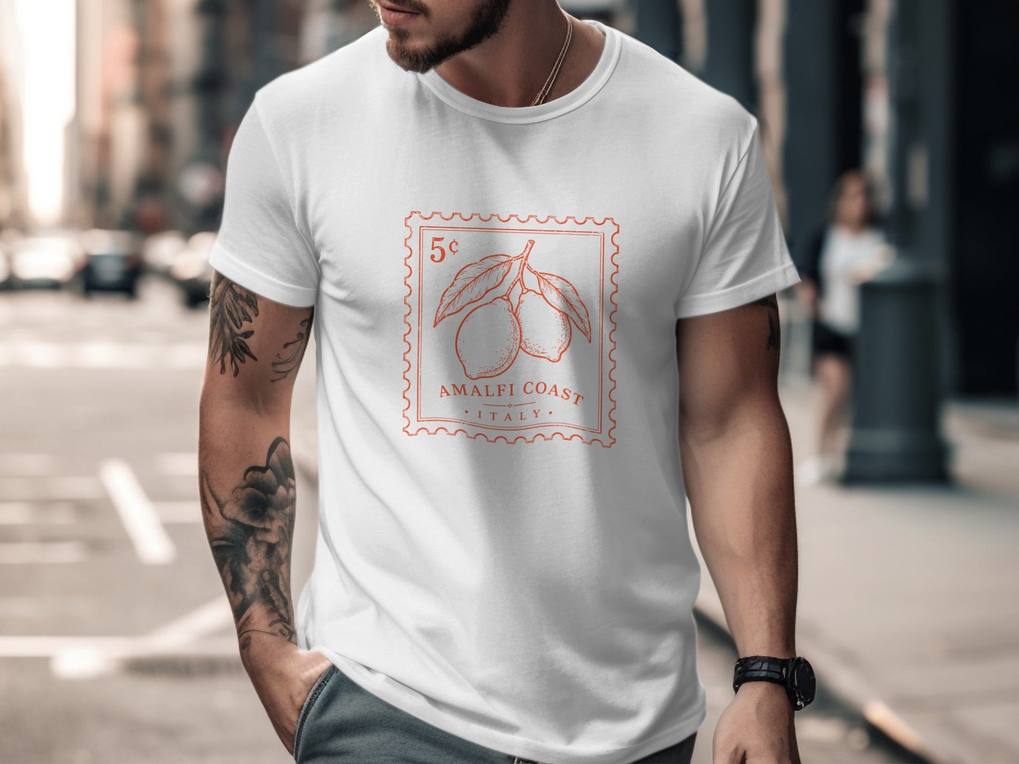 White t-shirt with orange stamp-like graphic of lemons, "Amalfi Coast", and "Italy".