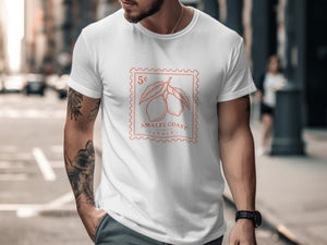 White t-shirt with orange stamp-like graphic of lemons, "Amalfi Coast", and "Italy".