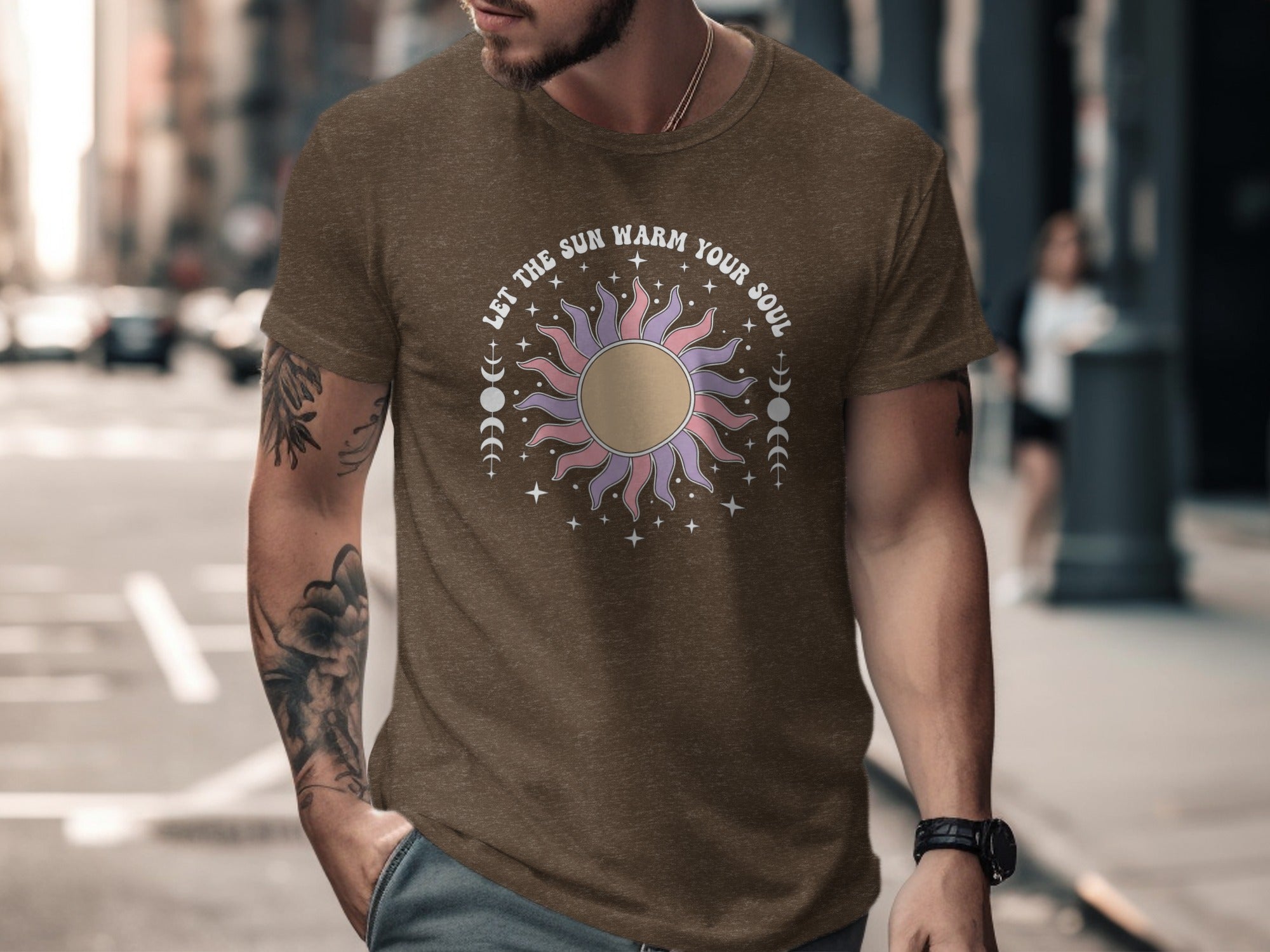 Brown t-shirt with sun graphic and "LET THE SUN WARM YOUR SOUL" text.