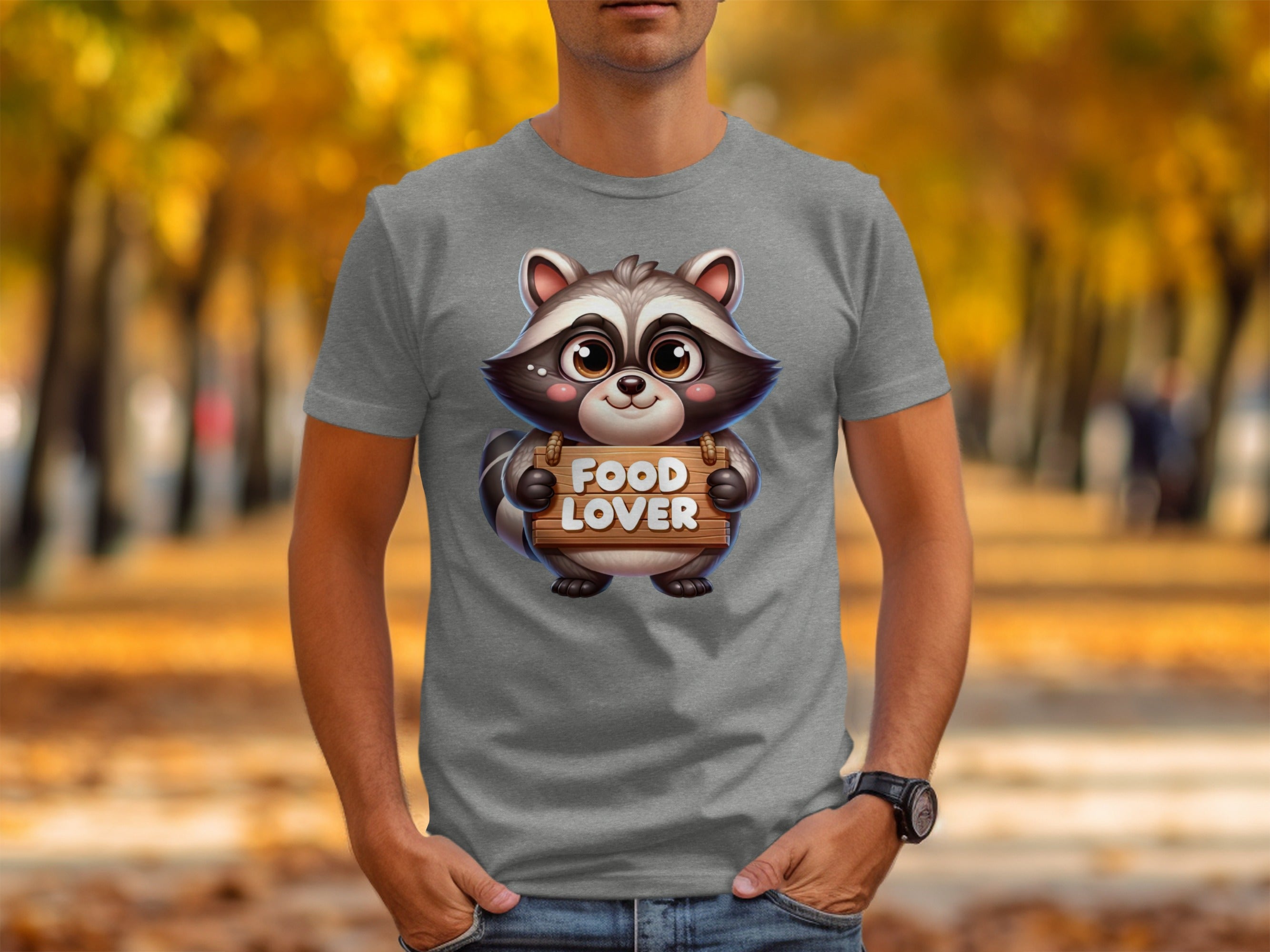 Graphic tee featuring a cute raccoon holding a wooden sign reading "FOOD LOVER".