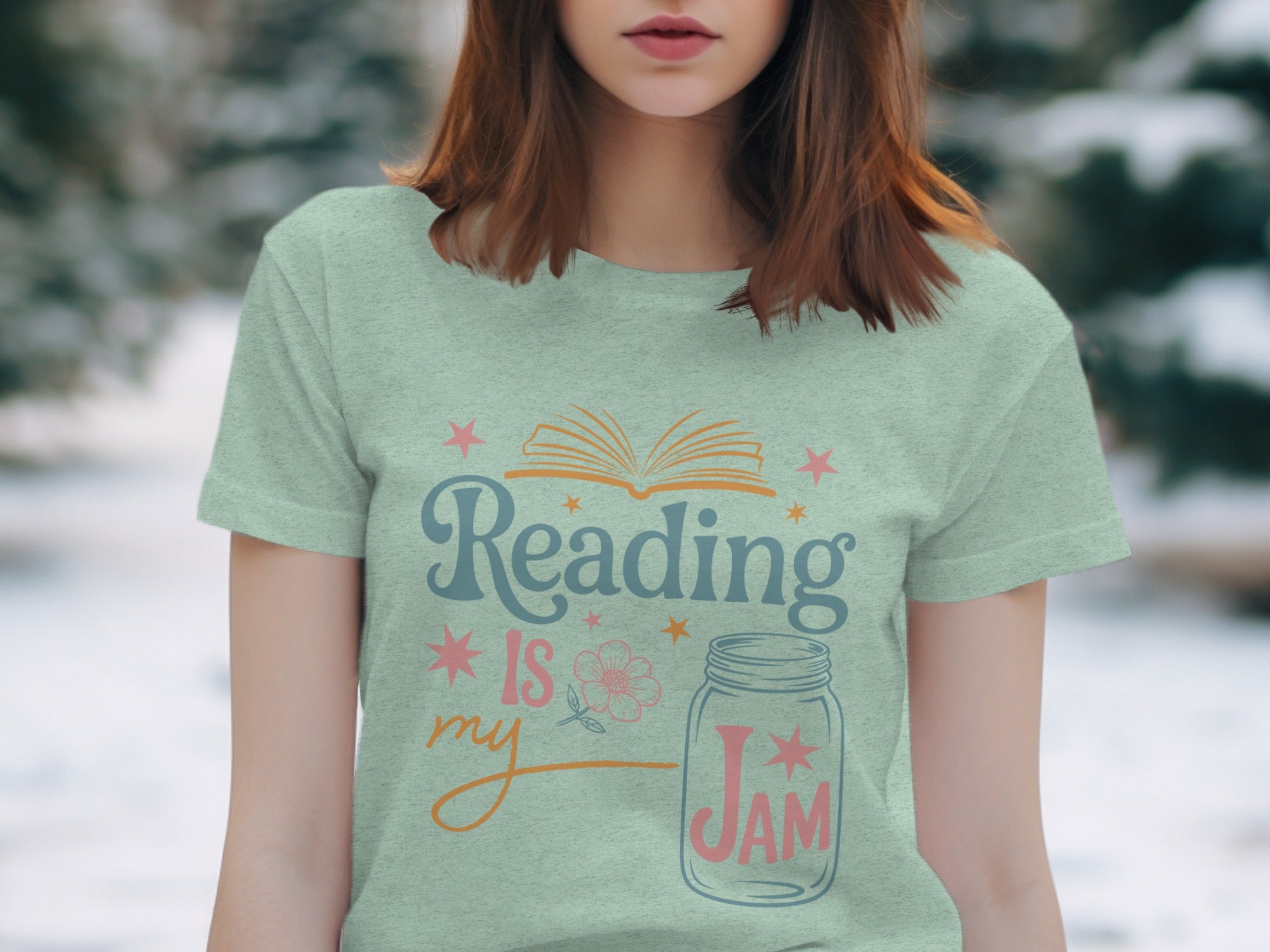 Light green t-shirt with "Reading Is My Jam" text design and illustrations.