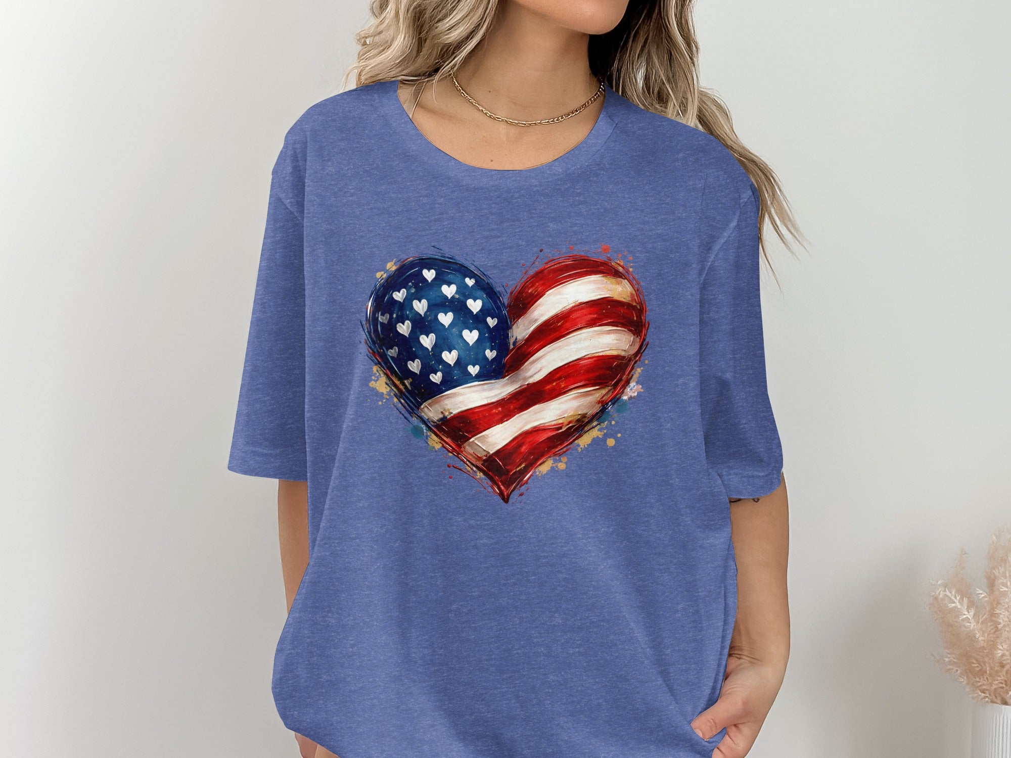 Blue t-shirt with an abstract American flag heart graphic.