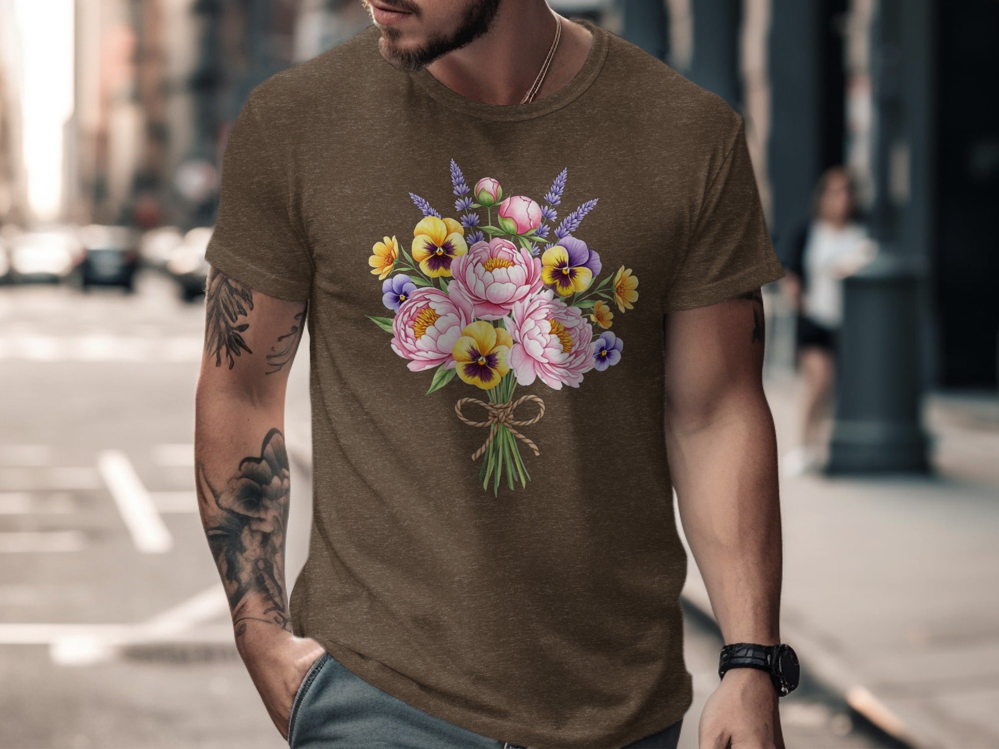 Brown t-shirt with a bouquet of pink peonies, yellow and purple pansies, and lavender.