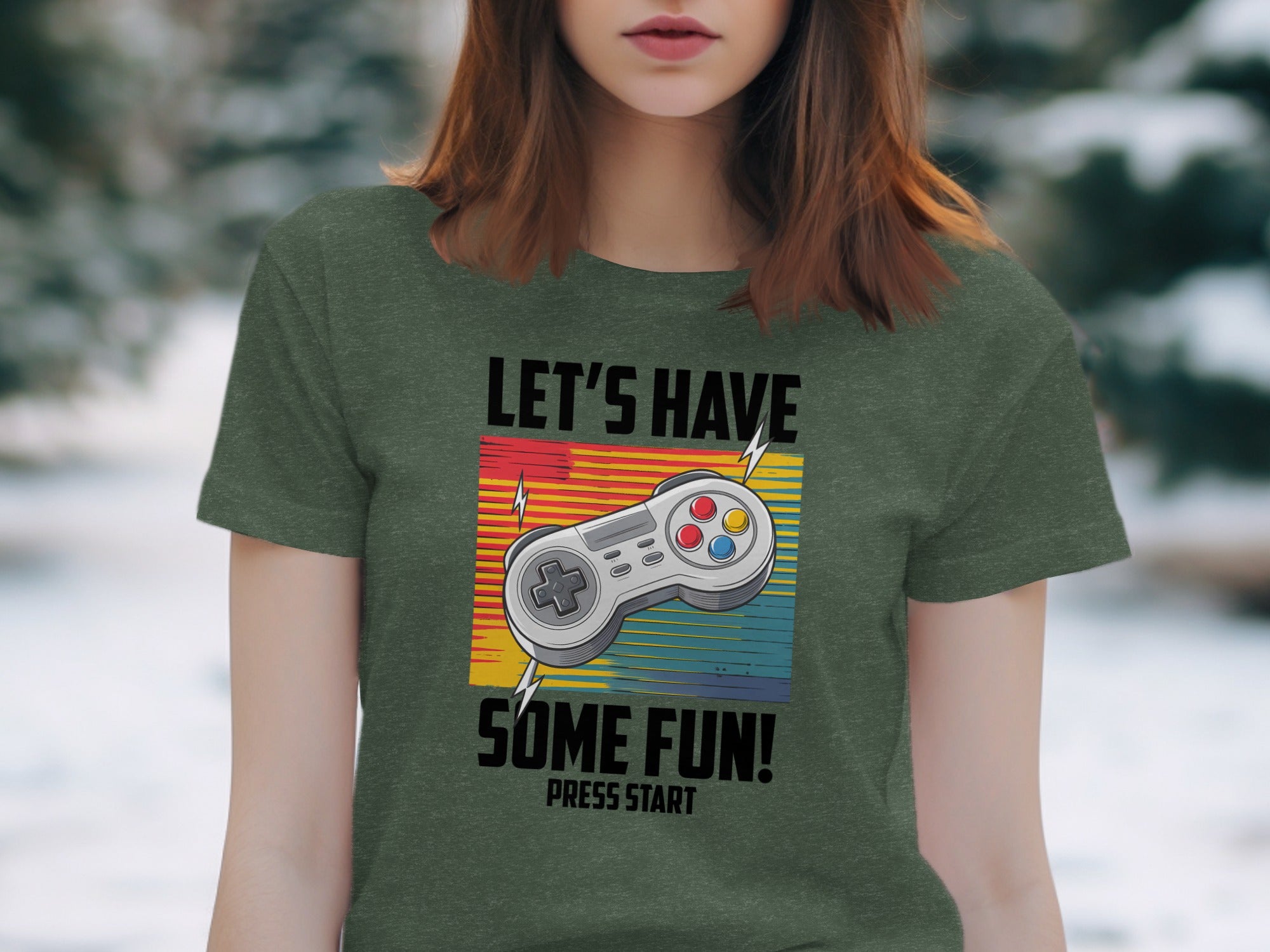 Green t-shirt with gaming controller graphic and text "LET'S HAVE SOME FUN! PRESS START".