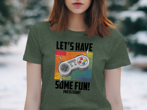 Green t-shirt with gaming controller graphic and text "LET'S HAVE SOME FUN! PRESS START".