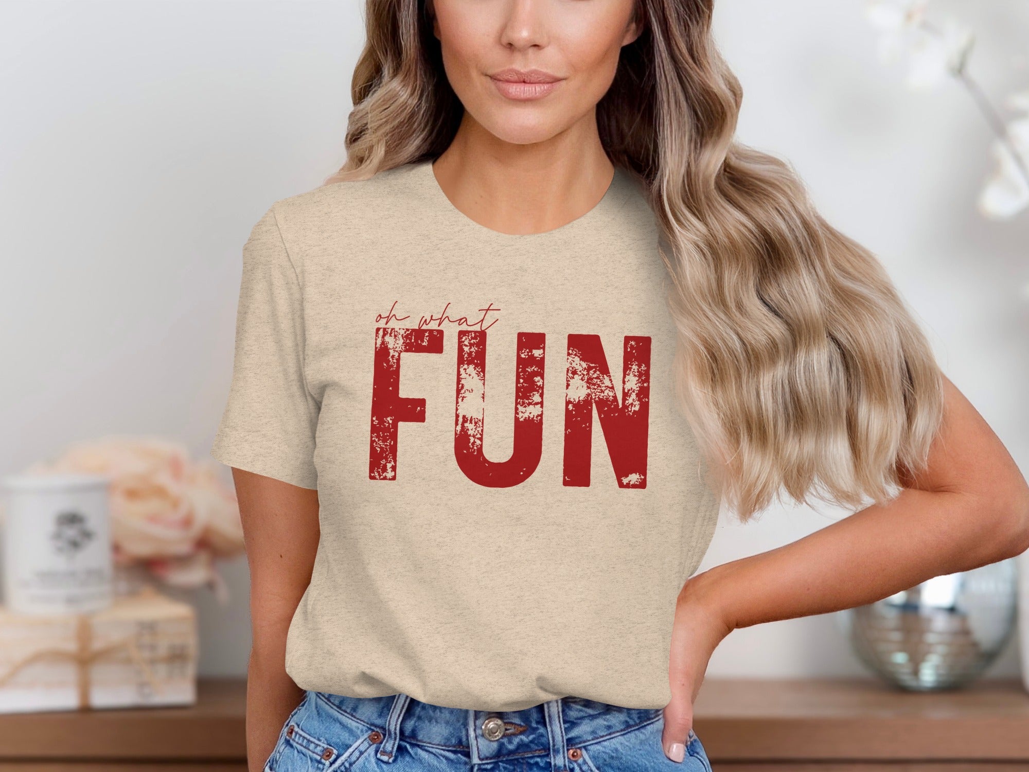 Tan t-shirt with red distressed text reading "oh what FUN".