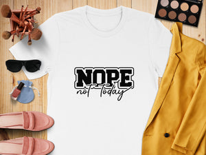 White t-shirt with black text "NOPE not today" surrounded by accessories.