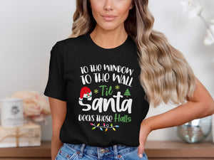 Black t-shirt with text "To the window to the wall 'til Santa decks these halls."