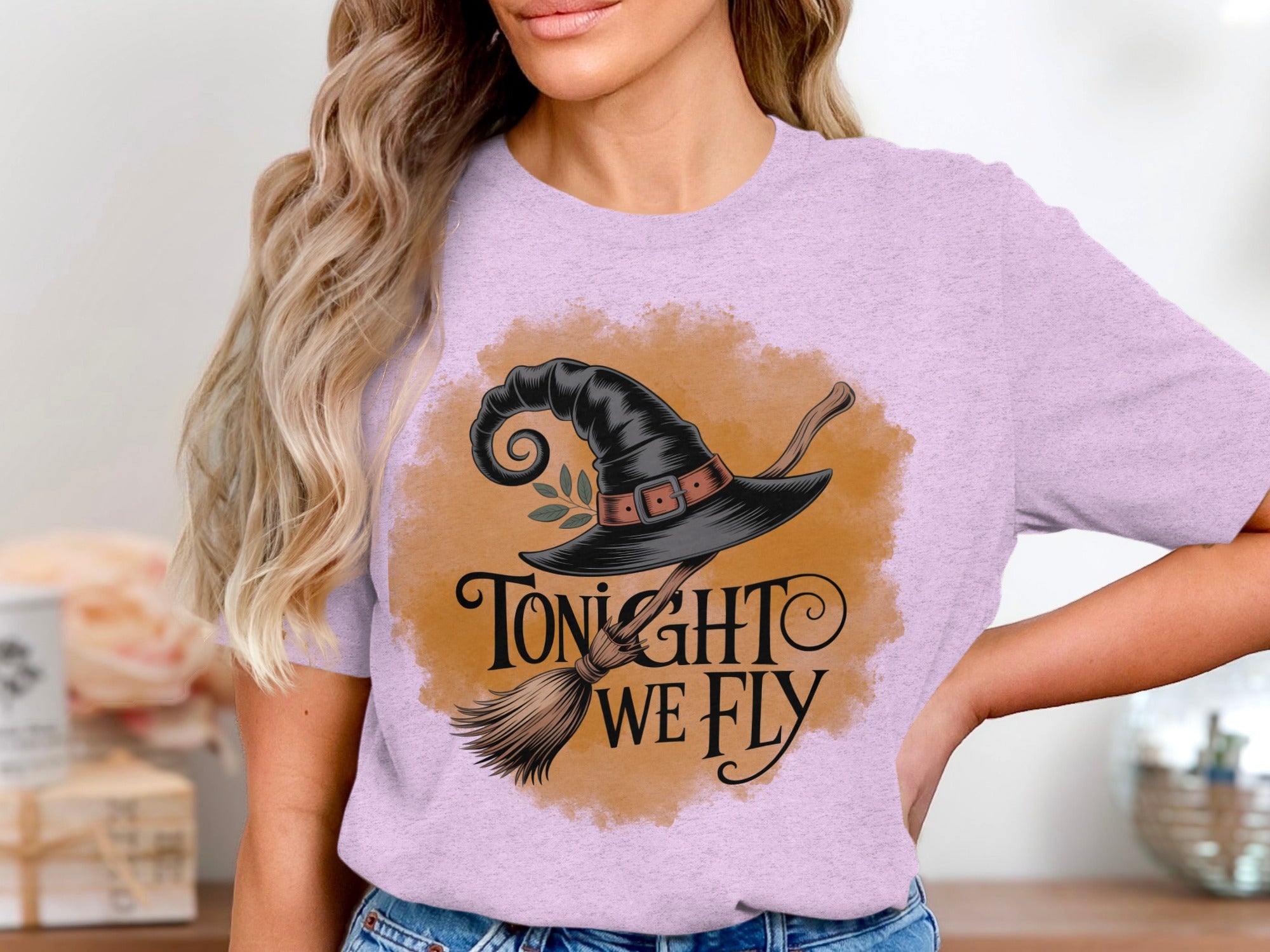 T-shirt with witch hat, broom, and text "Tonight We Fly".