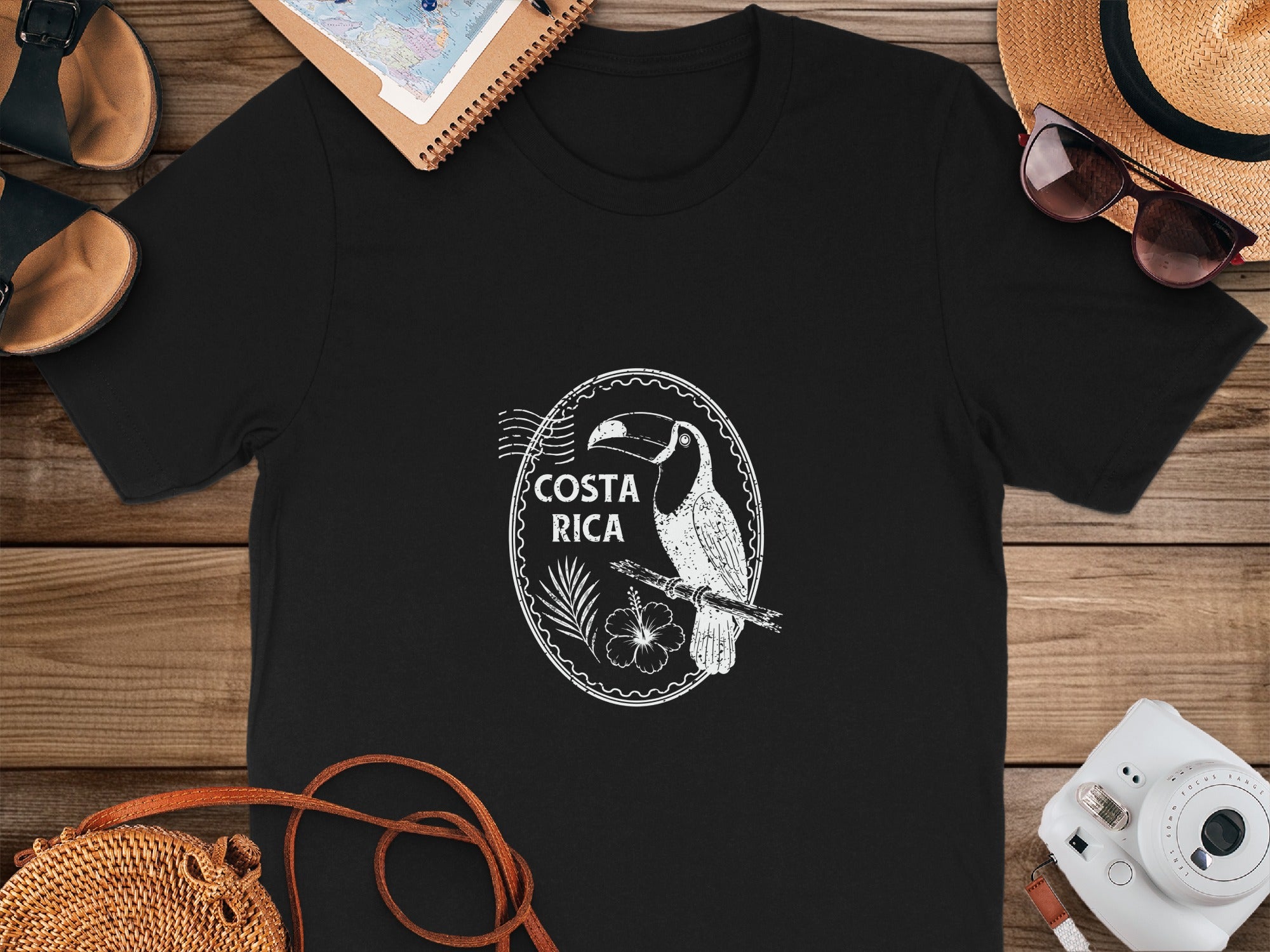 Black t-shirt with white toucan and "Costa Rica" stamp design.